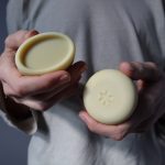 hands holding oval and big round pure soap