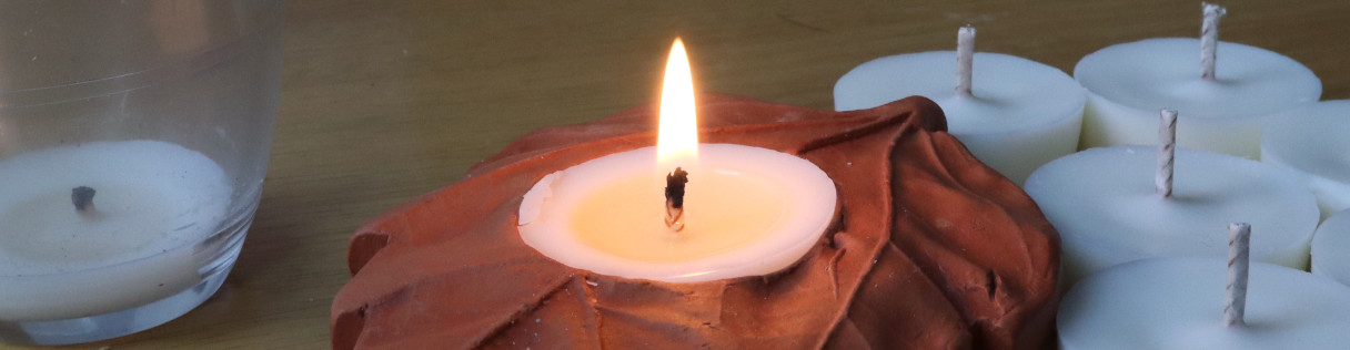 a lit tealight candle