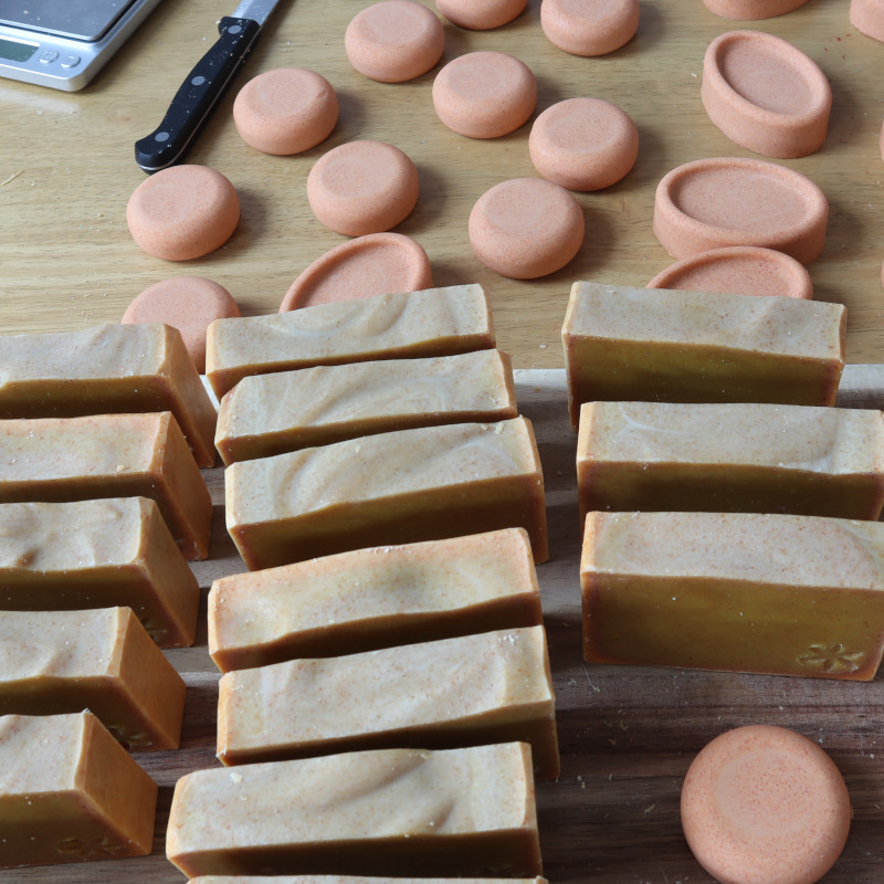 turmeric tiger soaps of different shapes laying on table